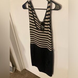 BCBGMaxazria black/cream colored dress in size Medium. New & never used
